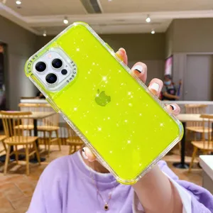 Detailed shot of neon green glitter phone case with camera protection, lifestyle angle.