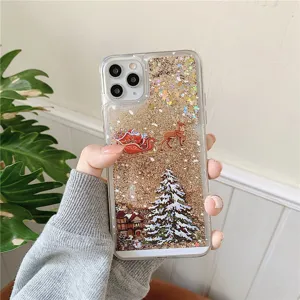 Close up of Christmas liquid glitter phone case with cute Santa and tree design for iPhone.