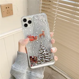 Christmas glitter phone case detail, transparent quicksand design with holiday graphics.