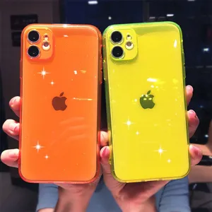 Detailed view of glossy glitter TPU candy phone cases in vibrant orange and neon green hues.
