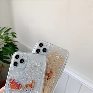 Detailed close-up view of clear liquid glitter phone case featuring festive Christmas design.