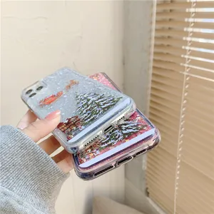 Christmas glitter quicksand phone case detail view showing winter tree design and hand grip.