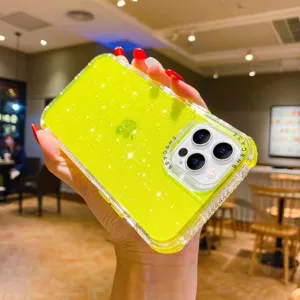 Detailed view of the sparkling yellow glitter phone case showing camera protection frame.