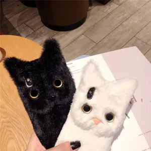 Fluffy plush cat phone case close-up showing soft texture, cute ears, and metal ring eyes.