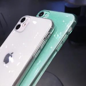Close-up detail shot of glitter TPU phone cases in sparkling white and mint green, glossy finish.