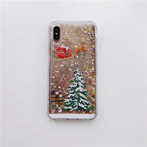 Close-up detail of Christmas glitter quicksand phone case with cute festive elements.