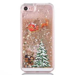 Close-up detail of Christmas liquid glitter phone case with festive snow and tree.