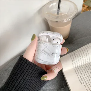 Marble texture protective case detail for AirPods wireless earphone charging box cover.
