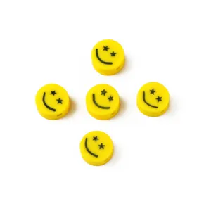 Yellow polymer clay smiley face beads with star eyes, DIY loose spacer beads for handmade bracelets.