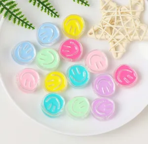 Colorful transparent acrylic smiley face bead detail shot for handmade DIY jewelry.