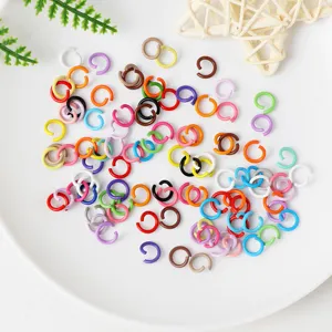 Colorful metal jump rings detail shot, ideal for handmade jewelry DIY craft projects.