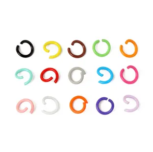 Colorful metal open jump rings detail, DIY handmade accessory material, close up view.