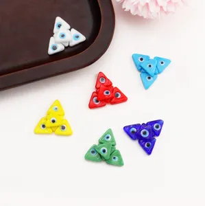 Detail view of colorful triangle evil eye glass loose beads for DIY jewelry making bracelets