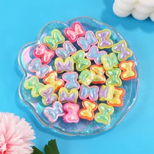 Acrylic colorful bow beads detail view, perfect for DIY handmade jewelry crafting and design.