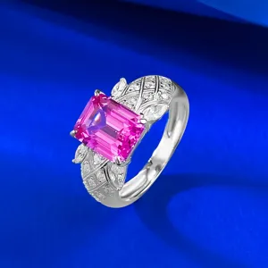Close-up detail of the stunning rectangular pink sapphire ring with delicate silver carved lattice.