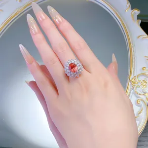 Atemberaubender S925 Silber Ring mit ovalem Padparadscha Edelstein und Doppelkranz.