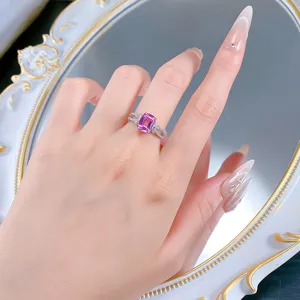 Detail shot of lab-created pink sapphire 925 silver ring featuring a cute bow design.