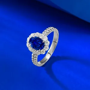 S925 Silber 5x7mm ovaler blauer Stein Ring mit edlem doppeltem Perlenrand-Design.