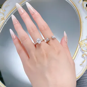 Gros plan détaillé de l'élégante bague empilable en argent avec moissanite ovale à la main.