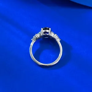 Detail shot of the S925 silver oval royal blue sapphire ring with elegant wing design.