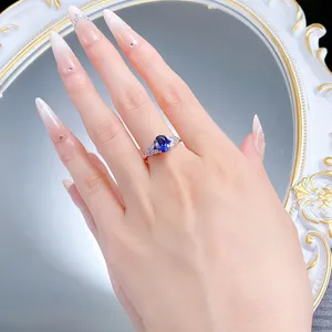 Elegant 925 silver oval royal blue gemstone ring with wing design detailed shot.
