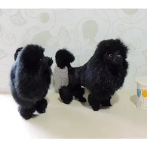 Detail shot of simulation black poodle plush figurine home decor, fluffy fur design.