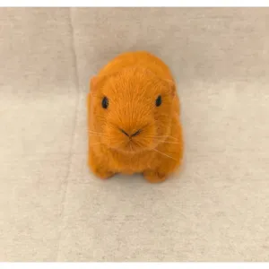 Close-up detail of simulation plush animal figurine with cute design and soft texture for decor.