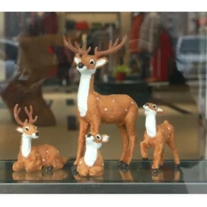 Detailed close-up view of simulation sika deer figurine set flocking desktop decor.