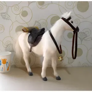 Simulation white plush horse toy model with saddle and reins for home decoration and gift.