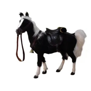 Handmade simulation horse toy with real goat fur, leather saddle, and reins for decor.
