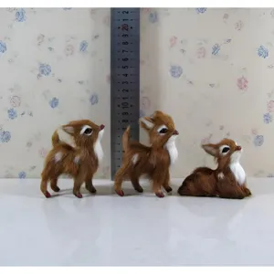 Detailed view of cute simulation faux fur sika deer figurines, forest style desktop decor.