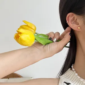 Gold small round ball stud earrings, minimalist minimalist jewelry detail shot, elegant style.
