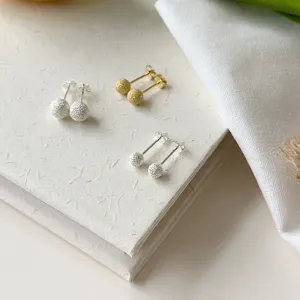 S925 silver matte round ball stud earrings detail shot, chic minimalist everyday jewelry style.