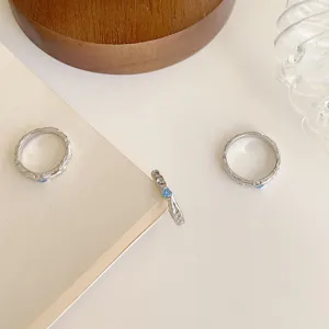 S925 sterling silver Korean style ice blue zircon heart ring with unique irregular texture.