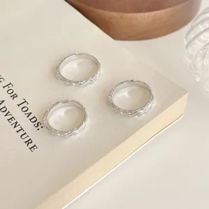Minimalist textured silver rings set, chic aesthetic finger jewelry for daily wear.