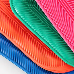 Detailed close-up view showing vibrant colorful ribbed PVC rubber hot water bottles.