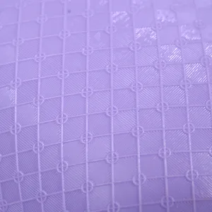 Detailed view of purple PVC hot water bag surface, featuring anti-slip grid texture.