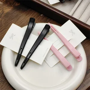 Seamless duckbill hair clips for bangs, makeup, and face washing in black and pink colors.