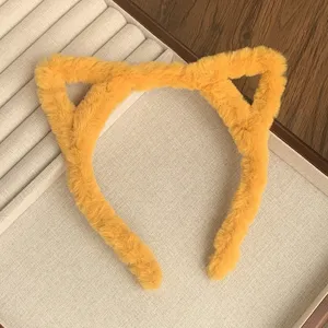 Detail view of the soft fluffy yellow cat ear headband for autumn and winter daily wear.