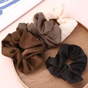 Satin hair scrunchies set of 4 pieces in elegant colors for daily styling and ponytails.