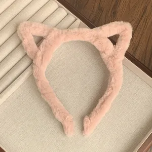 Cute pink plush cat ear headband for women, soft furry hair hoop for daily wear and washing face.