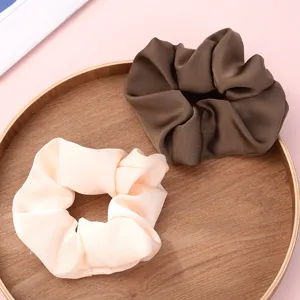 Satin hair scrunchies set, elegant vintage hair ties for women ponytails and buns detail view.
