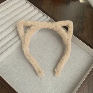 Fluffy cat ear headband for women, cute plush hair hoop, soft autumn winter fashion accessory.