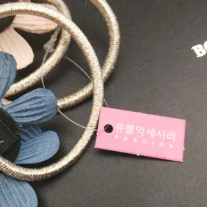Fashion metal glitter hair tie set with fabric flower decoration and cute pink hangtag for daily wear.