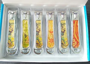 Boxed large stainless steel nail clipper set with decorative floral pattern handles.