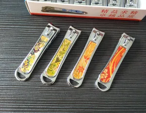 Stainless steel large nail clipper detail view with decorative colorful floral patterns on handle.