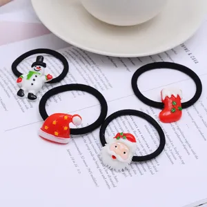 Christmas resin hair ties set, cute snowman and Santa Claus design hair accessories detail.