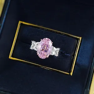 Stunning 8x12mm oval pink high carbon diamond ring in S925 silver with side stones.