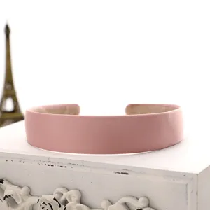 Close-up detail shot of a simple solid pink velvet hairband, elegant and sweet daily accessory.