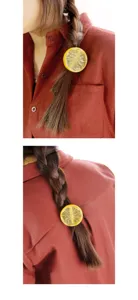 Detailed close-up view of the lovely lemon slice hair ring worn on braid ponytail.